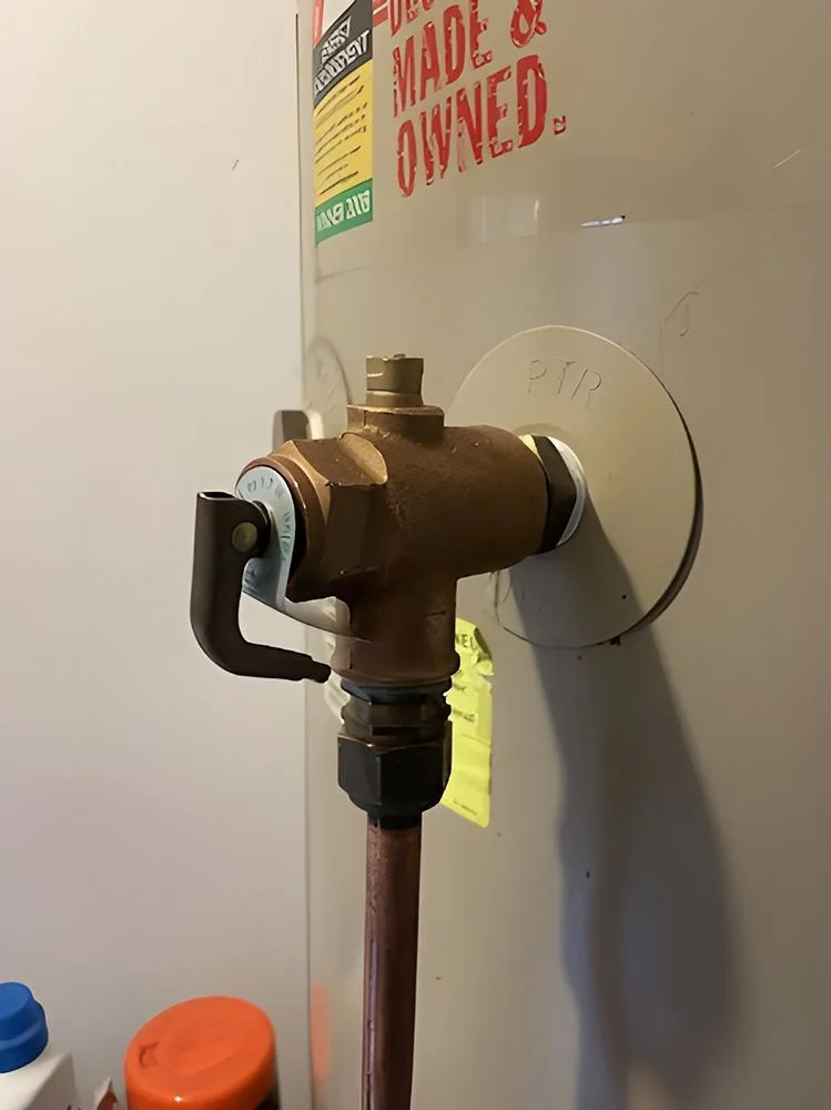 Hot water system valve and copper pipe connection at a Central Coast property